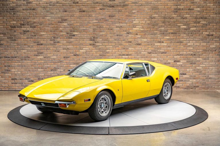 White tow truck with black car